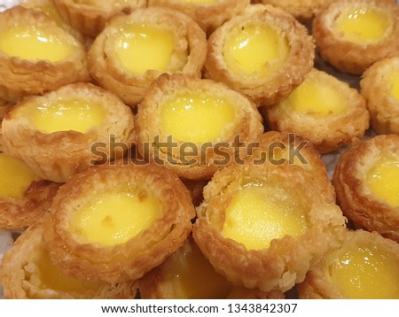 Mini Egg Tart. Egg tart is a kind of custard tart found in Macau, Hong Kong, Mainland China, and Asian countries. The dish consists of an outer pastry crust and is filled with egg custard and baked.  