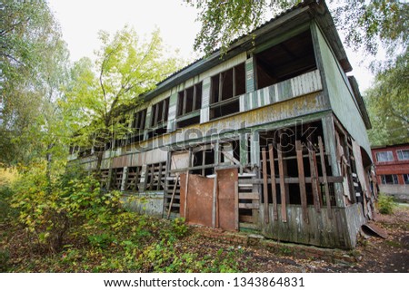 Old abandoned spooky wooden house. Horizontal color photography.
