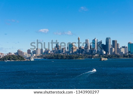 Epic view on Sydney cityscape with ferry boat. Modern urban skyline background