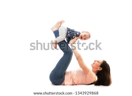 A mother and baby gymnastics, yoga exercises isolated on white background fitness