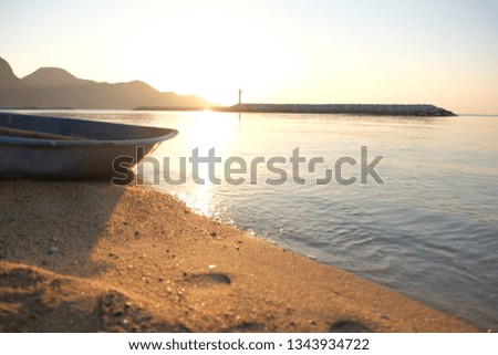 A boat on the beach in the morning