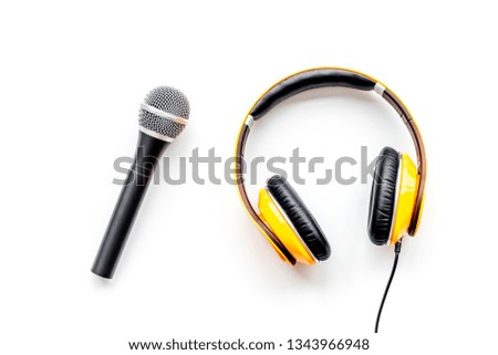 microphone and headphones for blogger, journalist or musician work on white background top view