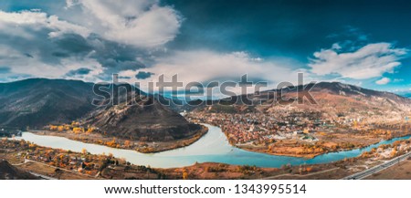 Mtskheta, Georgia. Top View Of Ancient Town Located At Valley Of Confluence Of Rivers Mtkvari Kura And Aragvi In Picturesque Highlands. Autumn Season. Panorama, Panoramic view Royalty-Free Stock Photo #1343995514