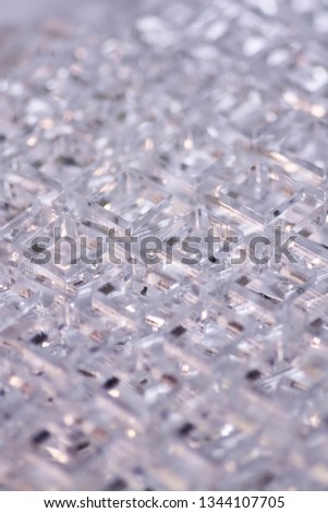 Abstract high-tech geometrical background. Details of transparent plastic or glass. Laser cutting of plexiglass or 3d printing.