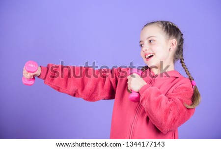 workout of small girl hold dumbbell. Fitness diet for energy. weight lifting for muscules. happy small girl. Sport success. Happy child sportsman with barbell. small girl training. fitness small girl.