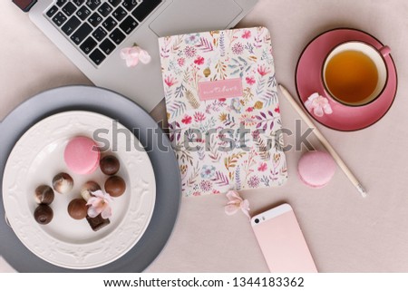 Morning. Laptop, cup, notebook on pink background.Blogging. Lifestyle