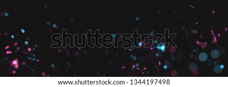 blurred magenta and cyan sparks from neon lights in front of black backgound Royalty-Free Stock Photo #1344197498