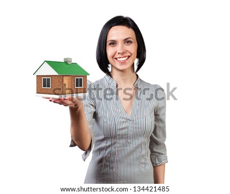 Photo of the girl with a house in a hand