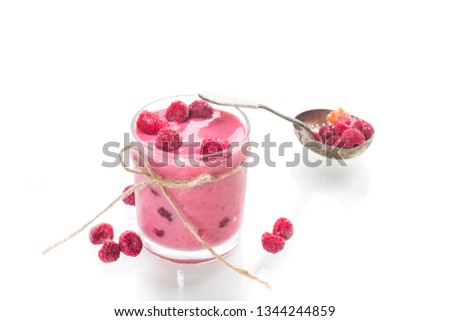 sweet organic smoothie with raspberry on wooden