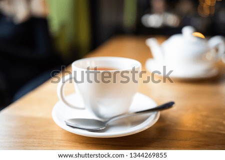 cup of tea at cafe blurred background