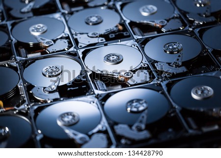 Closeup of the inside of harddrives Royalty-Free Stock Photo #134428790