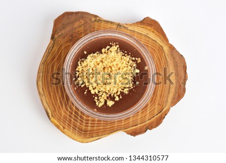 Chocolate pudding on wood plate