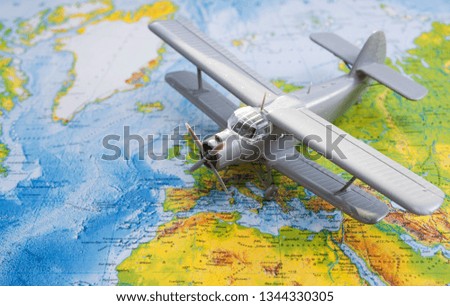 The plane on the background of the map. travel, tourism, air travel.