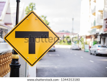 Metal Plate Traffic Sign: Intersection, Three way Junction, Split, Separate. The diamond shape sign with black T junction on yellow background, warning no more road straight ahead, minor to major road