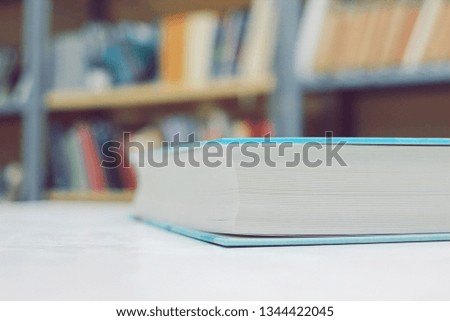 Blue book on white table