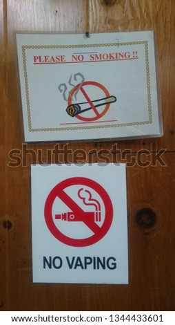 No smoking - no vaping signs on door - anti smoking - smoking ban 