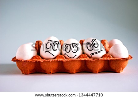 Creative easter eggs with painted emotions, funny eggs with faces