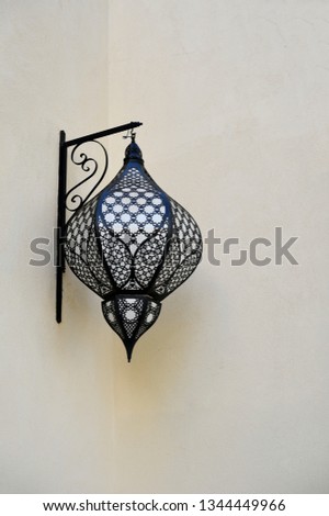 Vintage lamp with beautiful shadows on wall. Concept for Moroccan and Arabian culture and design