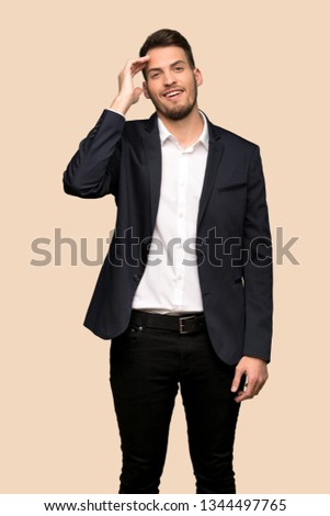 Handsome business man has just realized something and has intending the solution over ocher background