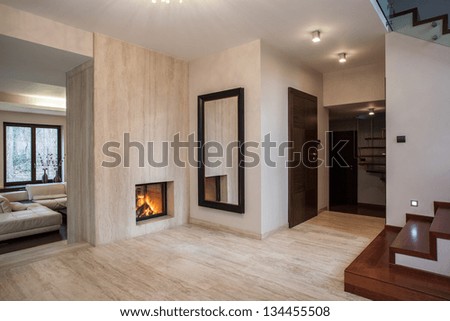 Travertine house: hallway, stairs and living room Royalty-Free Stock Photo #134455508