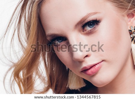 Beautiful blonde hair woman lashes beauty long curly hair isolated on white