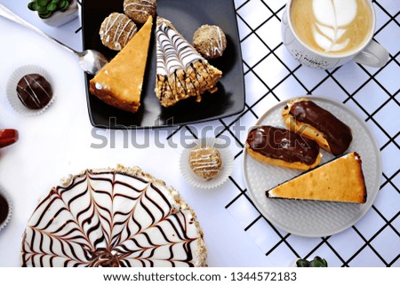 Picture of cakes on plates and coffee in cups on white background