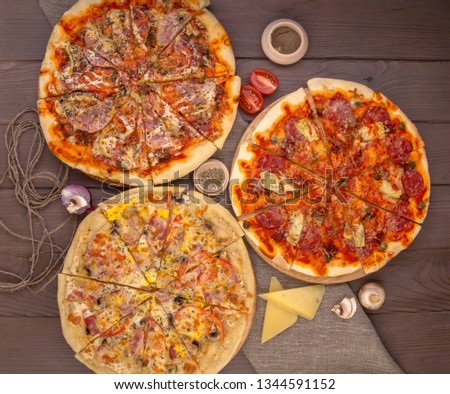 Assorted pizzas and ingredients