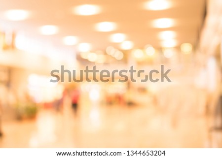 abstract blur inside interior luxury hotel background with bokeh light effect for design 