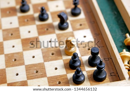 Chess on the Board on a light background. Road chess concept. Chess Board in sunlight.