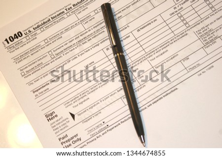 I040 Individual Income Tax Return Form most commonly used for filing taxes. Royalty-Free Stock Photo #1344674855