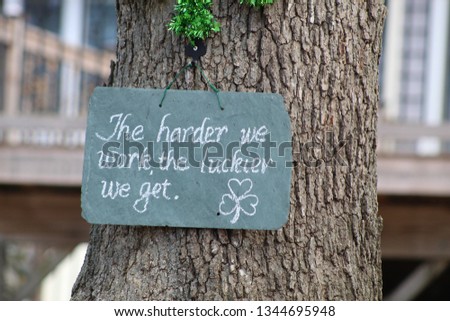 motivational sign on tree