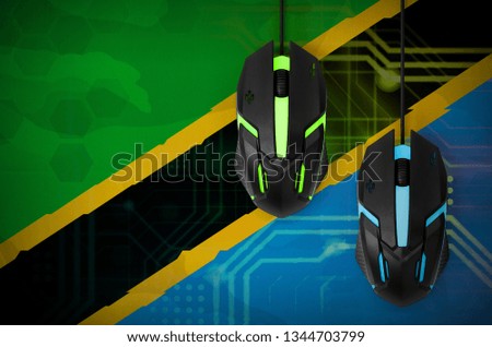 Tanzania flag  and two mice with backlight. Online cooperative games. Cyber sport team