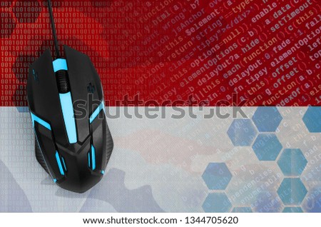 Indonesia flag  and computer mouse. Digital threat, illegal actions on the Internet