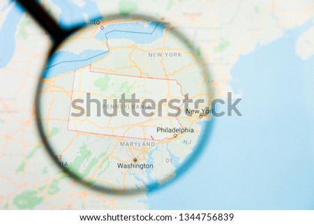 Pennsylvania, PA state of America visualization illustrative concept on display screen through magnifying glass