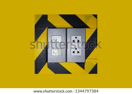 Electrical system and network and telephone outlet.Barely a yellow-black symbol to warn of danger points. on yellow background with clipping path.