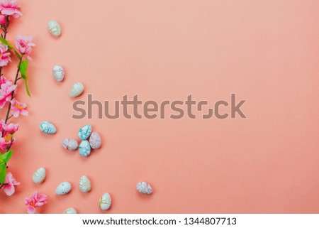 Table top view shot of decoration Happy Easter holiday background concept.Flat lay variety bunny eggs with flower on modern rustic pink paper.Copy space for creative design web and mock up & template.