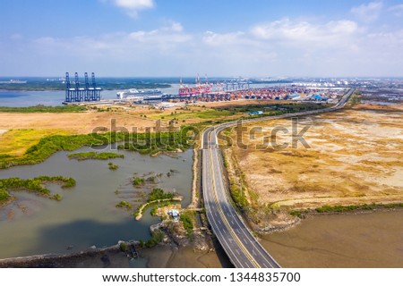Top view aerial of International  container port Tan Cang - Cai Mep. Ba Ria, Vung Tau, Vietnam. Connect to Ho Chi Minh City by Thi Vai river and national road 51, near Can Gio. 
