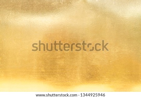 Gold metal has scratched the surface background.