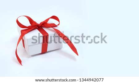 White box and red red ribbon. Gift. Holiday