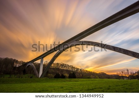 Natchez Trace Bridge, Franklin TN. Taken at sunset with a nice smooth long exposure. Royalty-Free Stock Photo #1344949952