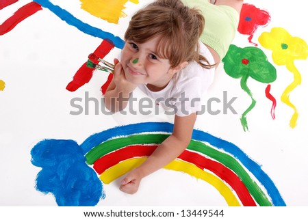 A cute young girl painting a picture
