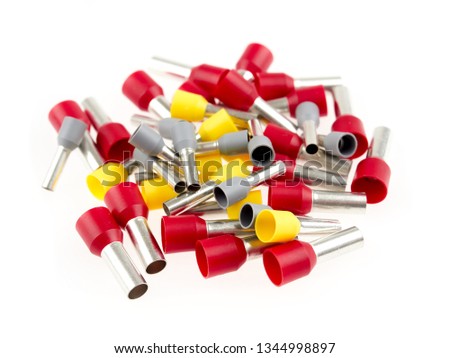 Various sizes of ferrules or end sleeves for electrical cables, isolated on white Royalty-Free Stock Photo #1344998897