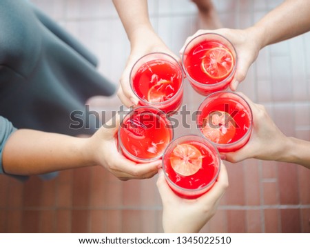 Close up of women hands clinking glasses for celebrating in the party