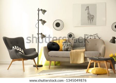 Stylish living room interior with comfortable sofa. Idea for home decor