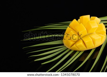 Peeled Pineapple on bamboo over black background
