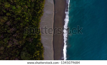 Aerial shot of rainforest and ocean on Osa Peninsula in Costa Rica Royalty-Free Stock Photo #1345079684