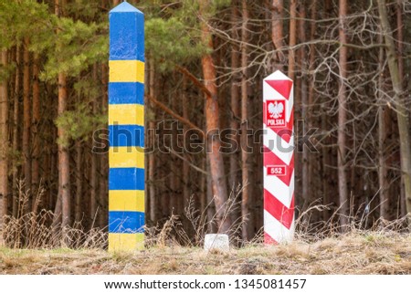 Ukrainian-Polish border, border pillars on the line between the two countries. The external border of the European Union. The protection of the state from the threat of smuggling and illegal migration Royalty-Free Stock Photo #1345081457