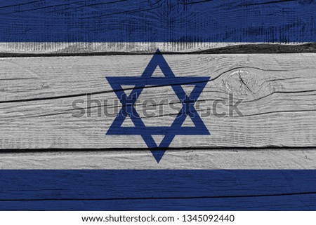 Israel flag painted on old wood plank. Patriotic background. National flag of Israel
