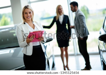 Picture of attractive saleswoman working in company