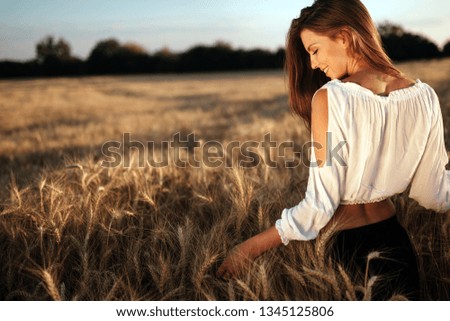 Young beautiful woman spending time in nature